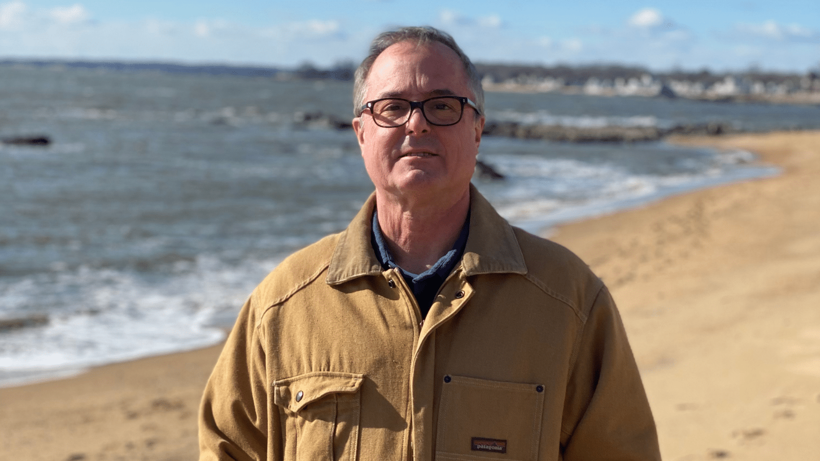 David Pfeifer standing on a beach